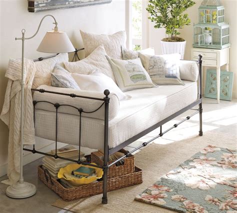 These classic beds for guest sleepovers easily transition into sofa-like seating for daytime use with the addition of a few throw pillows for support and added style. . Pottery barn day bed
